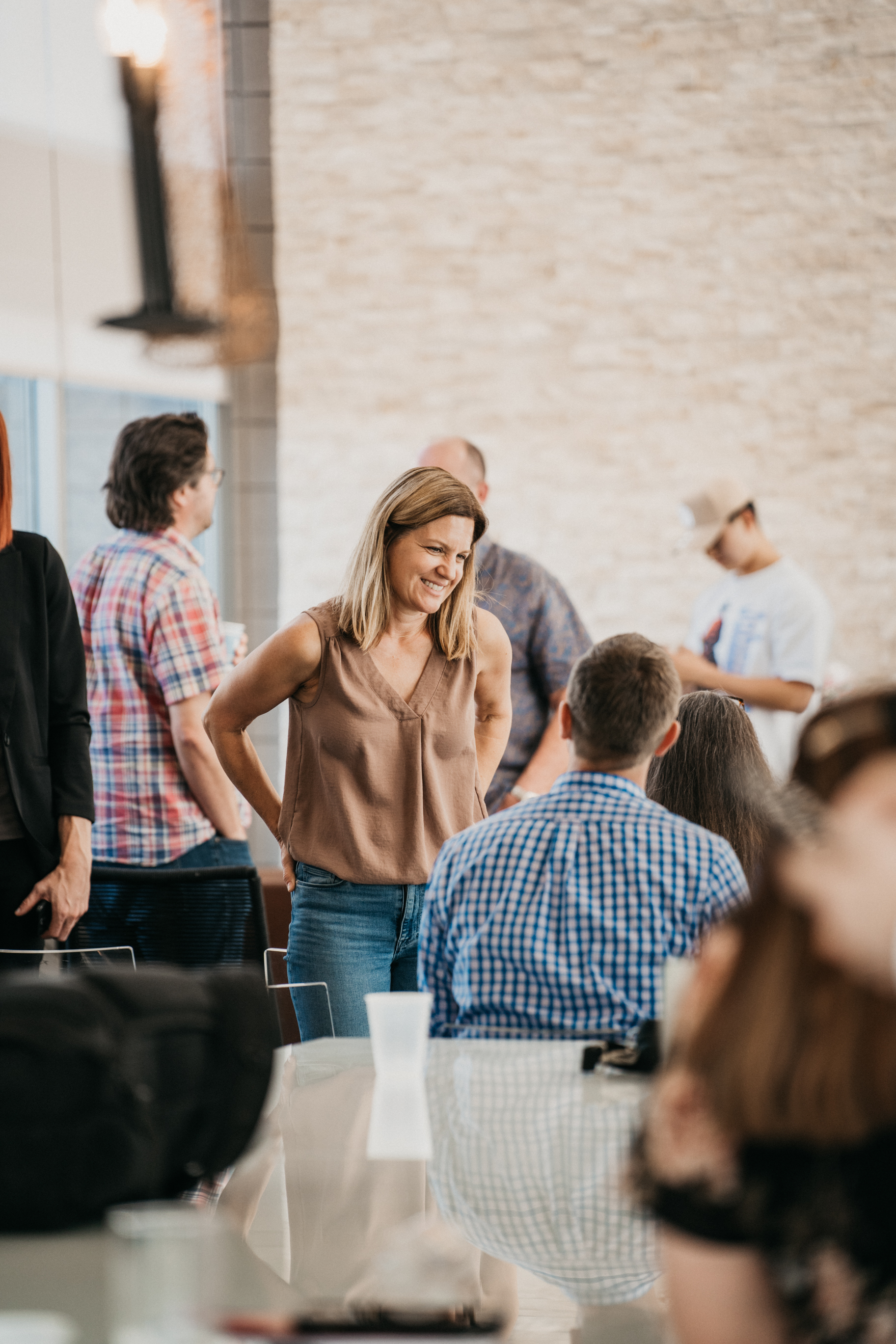 A member laughing with the people around her.